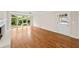 Bright living area with hardwood floors, a fireplace, and windows overlooking the landscaped backyard at 2179 Mountclaire Ct, Stone Mountain, GA 30087