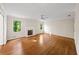 Spacious living room featuring hardwood floors, fireplace, and large windows at 2179 Mountclaire Ct, Stone Mountain, GA 30087