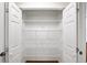 Open pantry with white wire shelving inside of a spacious closet at 2179 Mountclaire Ct, Stone Mountain, GA 30087