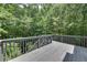 Spacious back deck surrounded by lush greenery, ideal for outdoor relaxation at 420 Gold Xing, Canton, GA 30114
