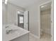 Bright bathroom featuring double sinks, neutral walls, and tiled floors at 420 Gold Xing, Canton, GA 30114