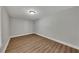 This bedroom features hardwood floors and a ceiling fan with overhead lighting at 420 Gold Xing, Canton, GA 30114