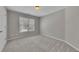 Bedroom with neutral-toned walls, plush carpet, and a window providing natural light at 420 Gold Xing, Canton, GA 30114