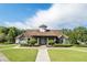 Attractive community clubhouse with stone facade, lush landscaping, and inviting entrance at 420 Gold Xing, Canton, GA 30114