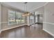 Elegant dining room with natural light, dark hardwood floors, and modern lighting at 420 Gold Xing, Canton, GA 30114
