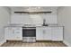 Clean kitchenette features granite countertops, stainless steel appliances, and subway tile backsplash at 420 Gold Xing, Canton, GA 30114