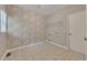 Functional laundry room with tile floors, a storage shelf, and a patterned accent wall at 420 Gold Xing, Canton, GA 30114