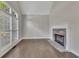 Bright living room with a stone fireplace and large windows, offering ample natural light at 420 Gold Xing, Canton, GA 30114