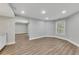 Bright living room features recessed lighting, gray walls, and beautiful hardwood floors at 420 Gold Xing, Canton, GA 30114
