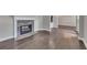 Elegant living room featuring a stone fireplace, wood floors, and an open floor plan at 420 Gold Xing, Canton, GA 30114