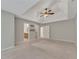Spacious main bedroom featuring a tray ceiling, ceiling fan, and ensuite bathroom at 420 Gold Xing, Canton, GA 30114