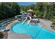 Inviting community pool with slides, seating and trees, promising summer fun for everyone at 420 Gold Xing, Canton, GA 30114