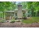 Back of home featuring a large screened porch and landscaped backyard at 4211 Burnt Hickory Nw Rd, Marietta, GA 30064