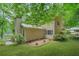 Rear view of home showing landscaped yard and views of the lake at 4211 Burnt Hickory Nw Rd, Marietta, GA 30064