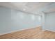 Finished basement space with light blue walls, wood flooring, and recessed lighting at 4211 Burnt Hickory Nw Rd, Marietta, GA 30064