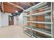 Unfinished basement space, with exposed wood ceiling and storage shelving at 4211 Burnt Hickory Nw Rd, Marietta, GA 30064