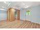 Finished basement space with wood floors and a walk-out door at 4211 Burnt Hickory Nw Rd, Marietta, GA 30064