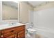 Bathroom featuring a vanity, toilet, and bathtub with tile surround at 4211 Burnt Hickory Nw Rd, Marietta, GA 30064