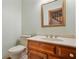 Stylish half bathroom with patterned wallpaper and a modern vanity at 4211 Burnt Hickory Nw Rd, Marietta, GA 30064