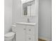Small bathroom with a modern sink, mirror and toilet at 4211 Burnt Hickory Nw Rd, Marietta, GA 30064