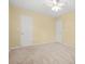 A bright bedroom with neutral carpet and a ceiling fan at 4211 Burnt Hickory Nw Rd, Marietta, GA 30064