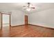 Spacious bedroom with ceiling fan, hardwood floors, and natural light at 4211 Burnt Hickory Nw Rd, Marietta, GA 30064
