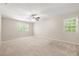 Spacious bedroom featuring neutral walls, carpet, and a ceiling fan for comfortable living at 4211 Burnt Hickory Nw Rd, Marietta, GA 30064