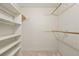 Walk-in closet with shelves and clothing rods for optimal organization at 4211 Burnt Hickory Nw Rd, Marietta, GA 30064