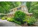 Lovely two-story home with lush landscaping, large porch, and convenient carport at 4211 Burnt Hickory Nw Rd, Marietta, GA 30064