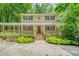 Charming two-story home featuring a large front porch and lush landscaping at 4211 Burnt Hickory Nw Rd, Marietta, GA 30064