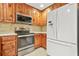 The kitchen features modern stainless steel appliances and wood cabinets at 4211 Burnt Hickory Nw Rd, Marietta, GA 30064