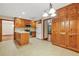 Well-equipped kitchen with wood cabinets, tiled floors, and modern appliances at 4211 Burnt Hickory Nw Rd, Marietta, GA 30064