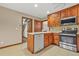 Bright kitchen featuring stainless steel appliances and wood cabinets at 4211 Burnt Hickory Nw Rd, Marietta, GA 30064