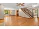 Bright living room with fireplace, hardwood floors, and access to the staircase at 4211 Burnt Hickory Nw Rd, Marietta, GA 30064
