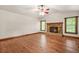 Spacious living room with hardwood floors and a stone fireplace at 4211 Burnt Hickory Nw Rd, Marietta, GA 30064