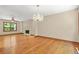 Charming living room featuring hardwood floors, fireplace and chandelier lighting at 4211 Burnt Hickory Nw Rd, Marietta, GA 30064