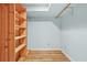 Walk-in storage room, with light blue walls, wood flooring and wooden storage shelves at 4211 Burnt Hickory Nw Rd, Marietta, GA 30064