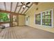Covered sunroom with wood floors and vaulted ceiling, perfect for enjoying the outdoors at 4211 Burnt Hickory Nw Rd, Marietta, GA 30064