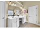 Spacious bathroom with double sinks and a large mirror over white cabinetry at 4315 Balsam Bark Dr, Cumming, GA 30028