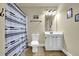 Practical bathroom equipped with a shower, toilet, and vanity, designed for convenience and efficiency at 4315 Balsam Bark Dr, Cumming, GA 30028