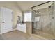 Bright bathroom features a sleek, glass shower, a soaking tub, and classic tile work at 4315 Balsam Bark Dr, Cumming, GA 30028