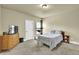 Inviting bedroom with a comfortable bed, dresser, and neutral color scheme at 4315 Balsam Bark Dr, Cumming, GA 30028