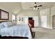 Large bedroom with a ceiling fan, vaulted ceilings, and neutral carpeting at 4315 Balsam Bark Dr, Cumming, GA 30028