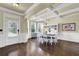 Elegant dining room with coffered ceilings, hardwood floors, and ample natural light at 4315 Balsam Bark Dr, Cumming, GA 30028