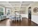 Elegant dining room with coffered ceilings, hardwood floors, and an adjoining doorway at 4315 Balsam Bark Dr, Cumming, GA 30028