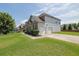 Spacious two-car garage with ample driveway space, complemented by a well-kept lawn at 4315 Balsam Bark Dr, Cumming, GA 30028