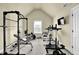 Home gym with weight machines, pull up bar, carpet, and a television at 4315 Balsam Bark Dr, Cumming, GA 30028