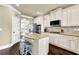 Bright kitchen featuring granite countertops, stainless appliances, and a convenient island with barstool seating at 4315 Balsam Bark Dr, Cumming, GA 30028