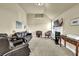 Comfortable living room with a fireplace, plush seating, and natural light creates a welcoming space for relaxation and entertainment at 4315 Balsam Bark Dr, Cumming, GA 30028