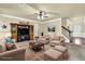 Comfortable living room with ceiling fan, plush seating, and decorative rug, perfect for relaxing and entertaining at 4315 Balsam Bark Dr, Cumming, GA 30028